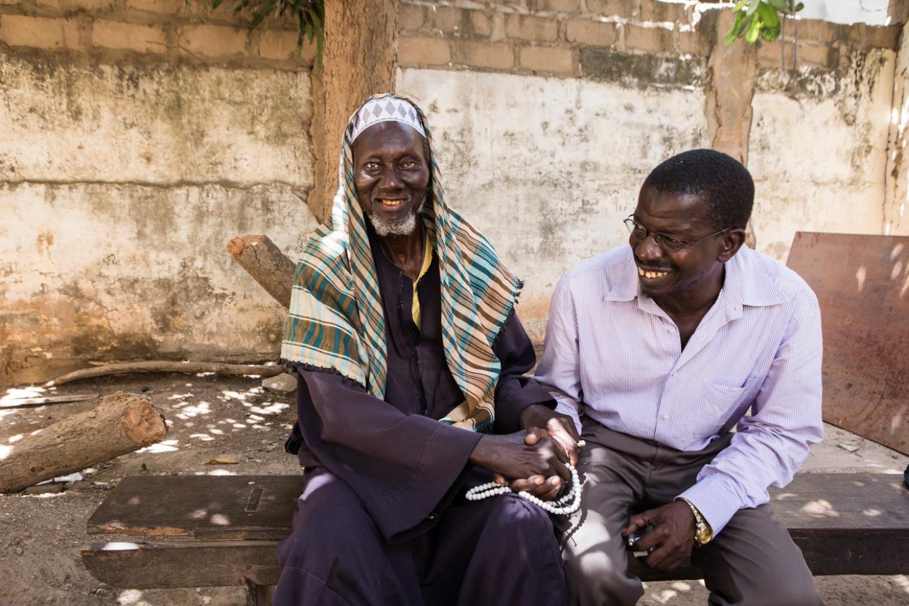 a man shakes hands with his nurse