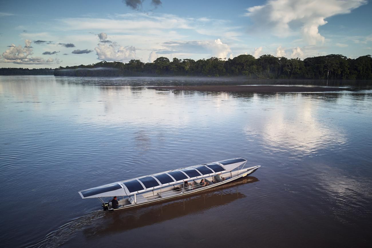 Sunkirum, a solar-powered canoe, sails on the Pastaza River in the Amazon in Ecuador, where the Achuar Indigenous people have lived for thousands of years.