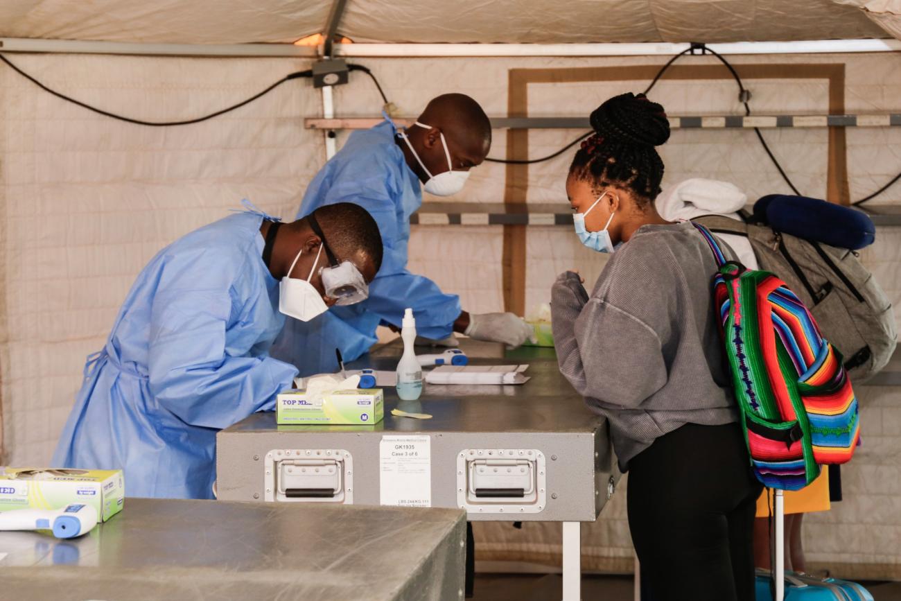 Passengers register their information on arrival at Sir Seretse Khama International Airport in Gaborone, Botswana, June 3, 2020. 