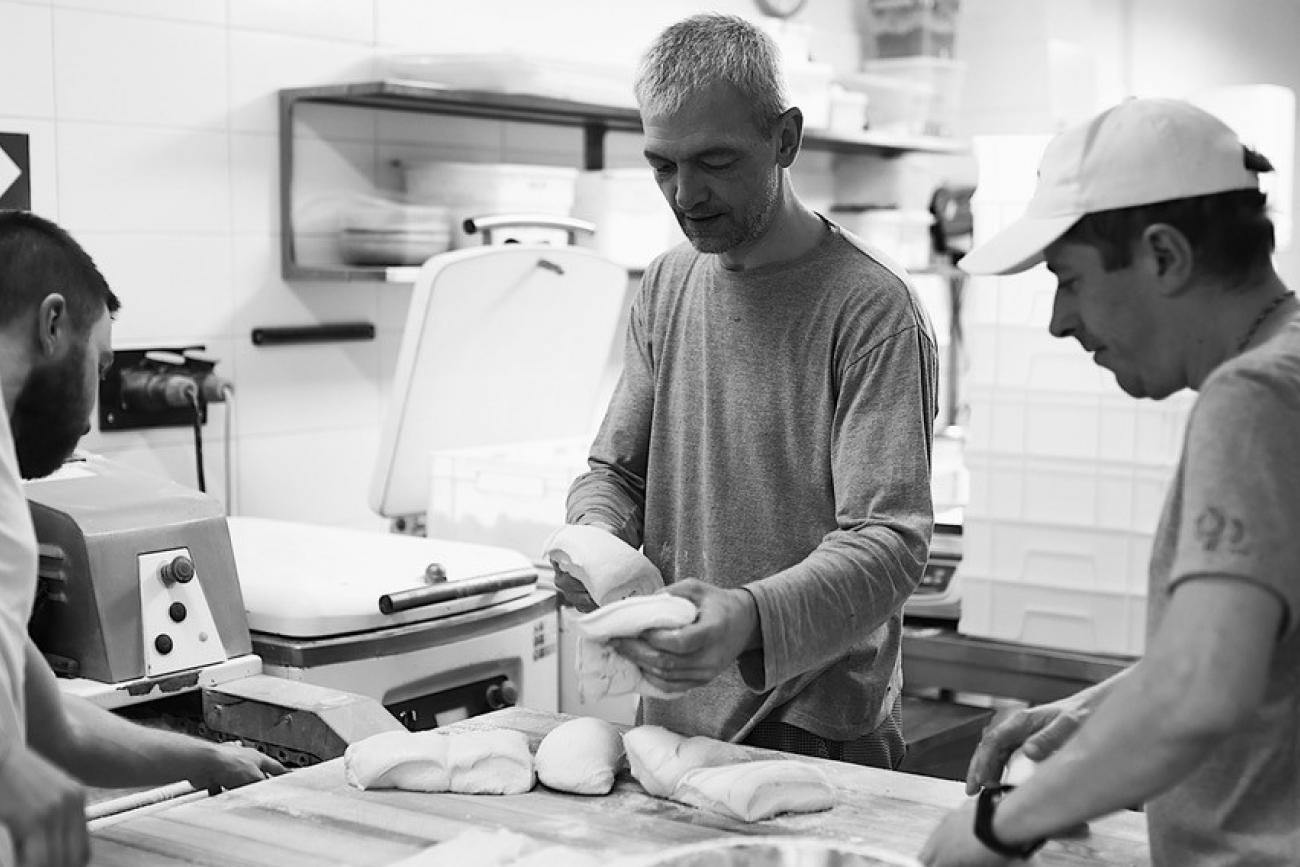 Bakers knead dough during the Battle of Kyiv at Bakehouse in Kyiv, Ukraine, March 13, 2022