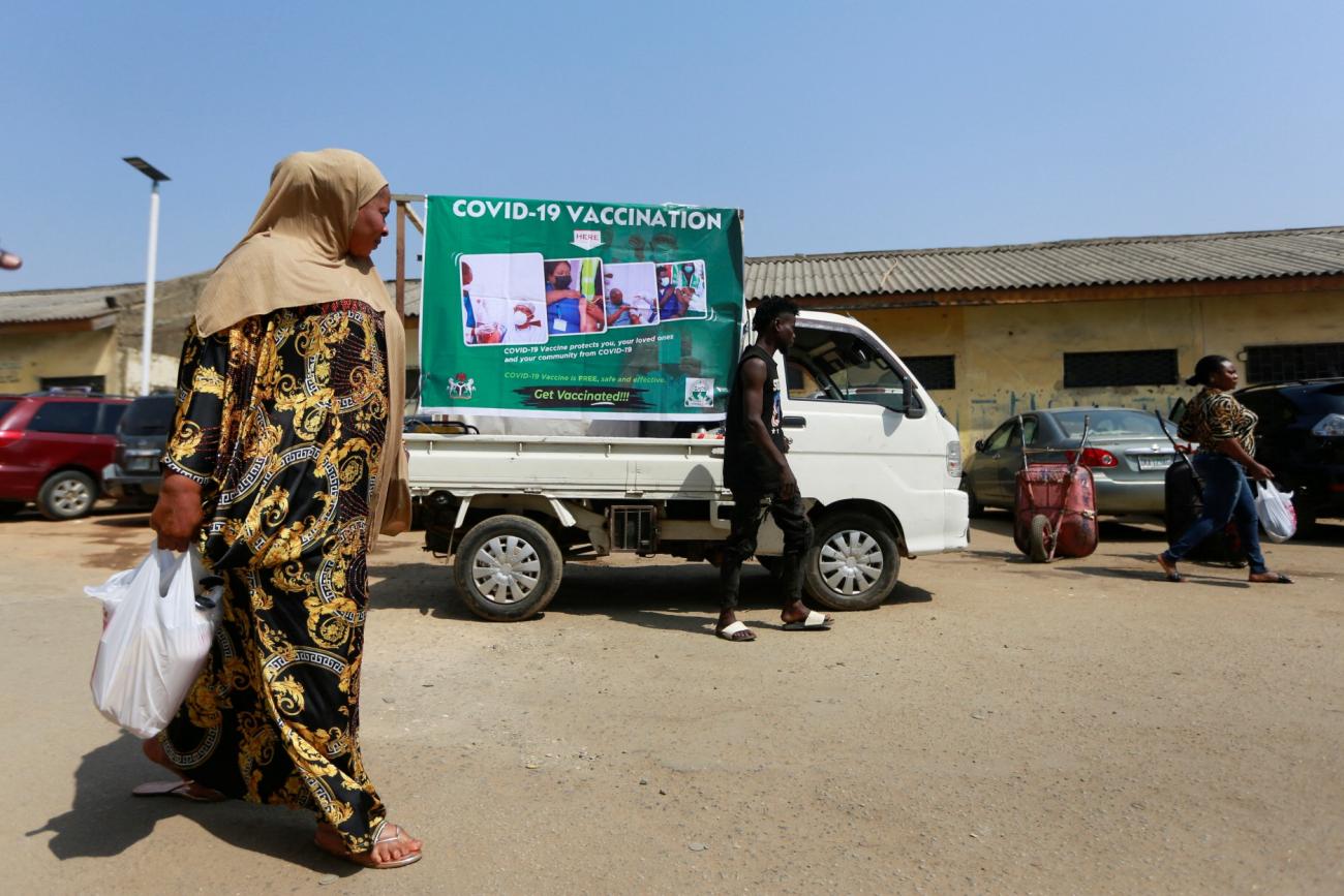 DOCUMENT DATE:  January 26, 2022  A woman walks past a coronavirus disease (COVID-19) campaign truck during a mass vaccination exercise at Wuse market in Abuja, Nigeria January 26, 2022.