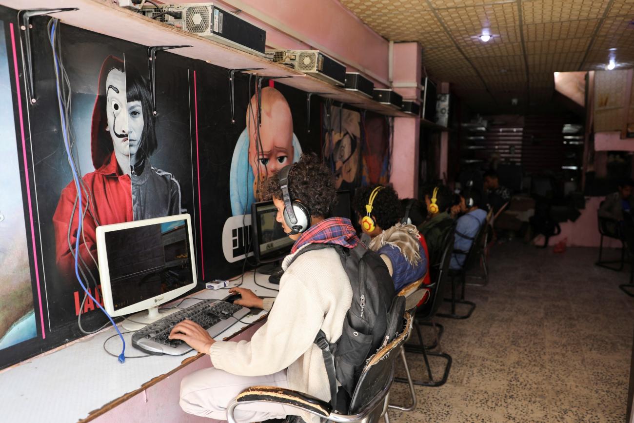 people use computers at an internet cafe after internet services were restored following a four-day outage