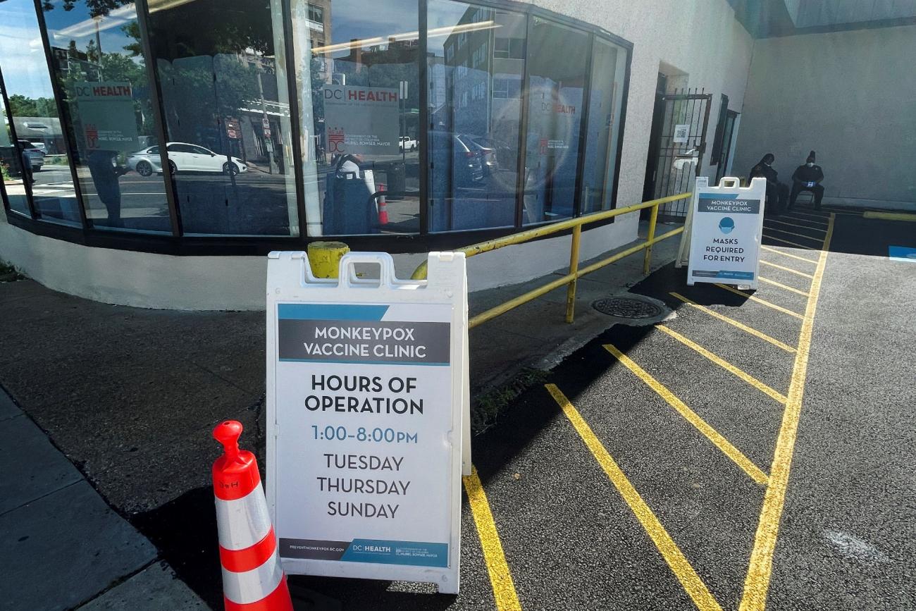 a monkeypox vaccination sign is seen in a parking lot