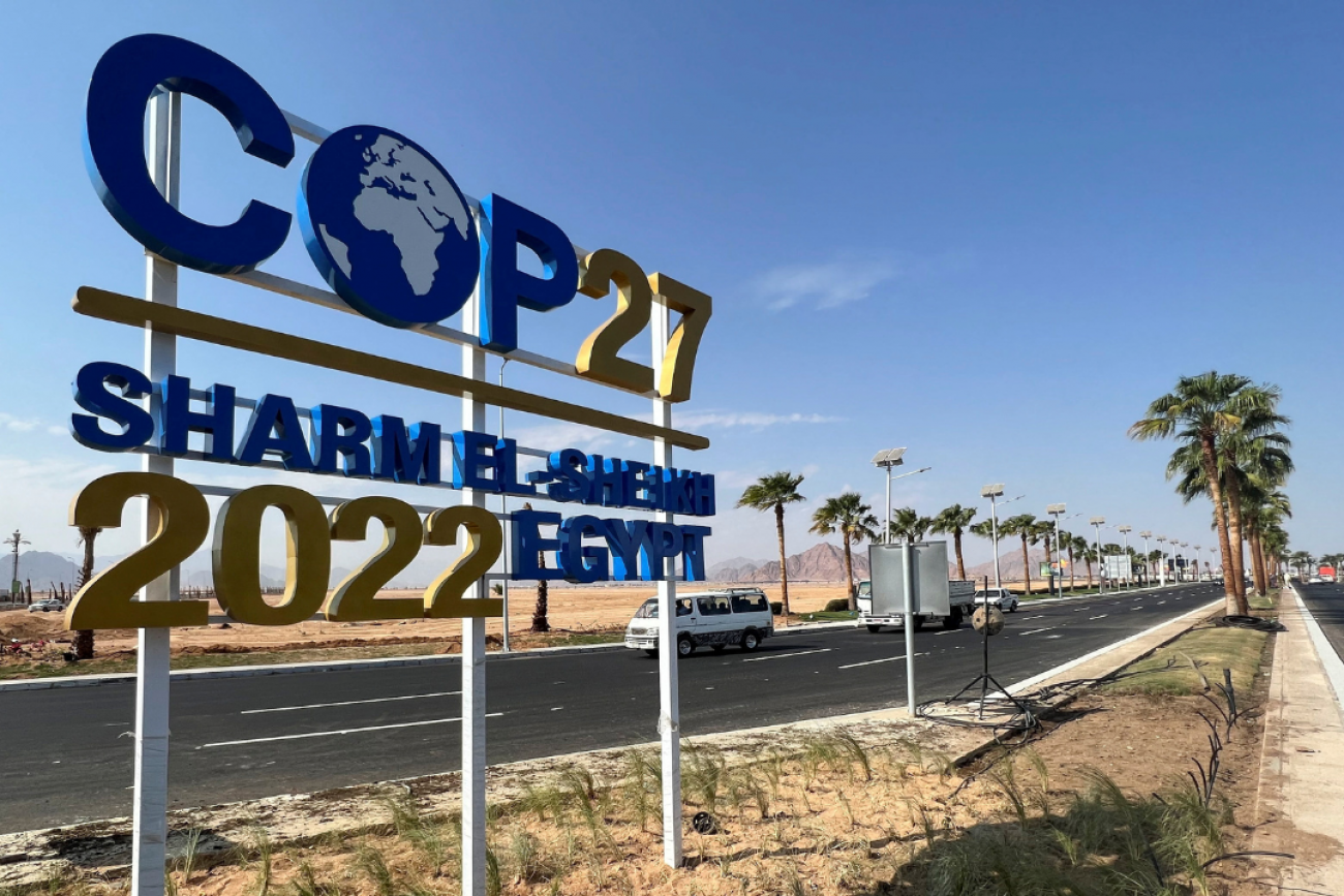 View of a COP27 sign on the road leading to the conference area in Egypt's Red Sea resort town of Sharm el-Sheikh as the city prepares to host the COP27 climate summit, in Sharm el-Sheikh, Egypt, on October 20, 2022. 