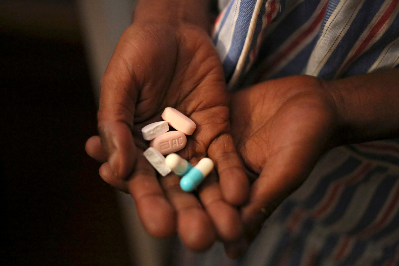 A close-upu image of a nine-year-old boy's hands holding antiretroviral (ARV) pills prescribed for HIV infection at Nkosi's Haven, in Johannesburg, South Africa.