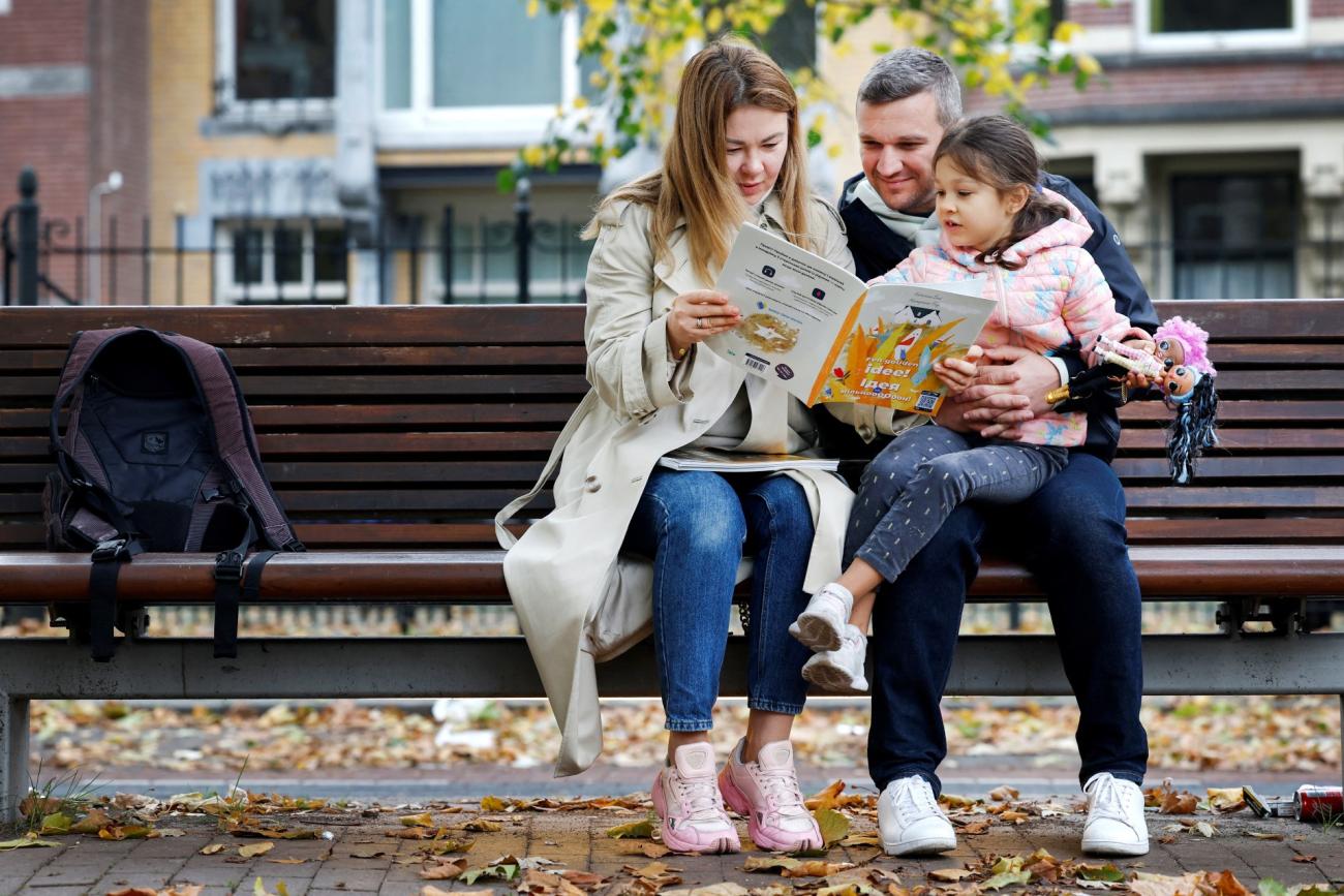 Ukrainian family Mykhalchenko read and listen to Better Time Stories, a project introduced for Ukrainian children who are seperated from their families in Rotterdam, Netherlands October 25, 2022. 