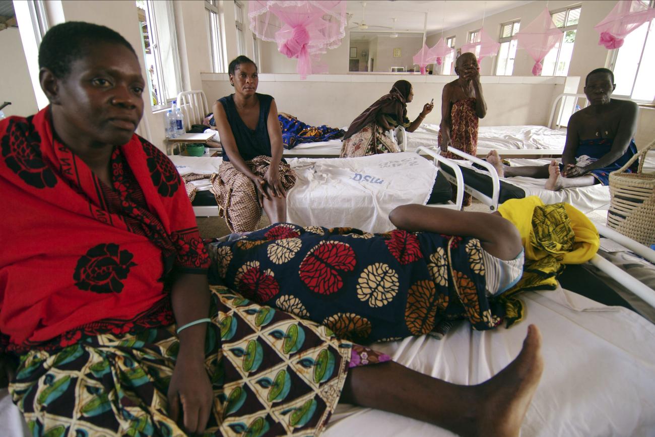 Rukia Kondogoza, a cervical cancer patient, shares a bed in a female ward of a cancer institute in the capital Dar es Salaam, Tanzania, on November 11, 2009. 