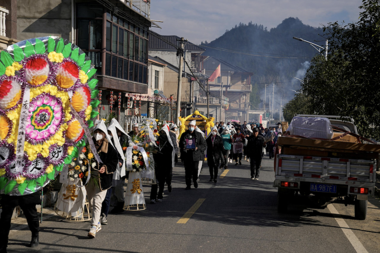 Relatives and neighbors attend the funeral of a woman surnamed Liu, as coronavirus disease (COVID-19) outbreak continues, at a village in Tonglu county, Zhejiang province, China, January 9, 2023. REUTERS/Aly Song