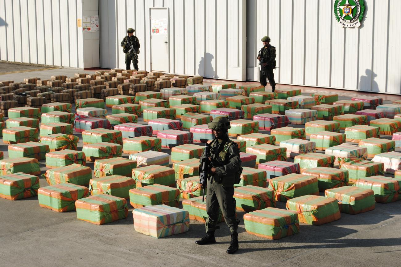 Colombian anti-drugs policemen guard stacks of marijuana seized from the rural area of El Jagual at a military police base in Popayan October, 23, 2011.