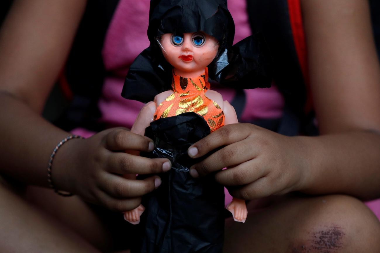 A child attends a protest against the rape of an eight-year-old girl, in Kathua, near Jammu and a teenager in Unnao, Uttar Pradesh state, in New Delhi, India, on April 15, 2018.