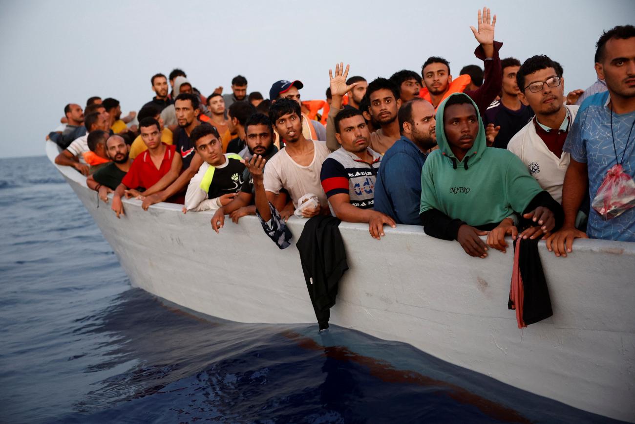 Multiple refugees in a boat.