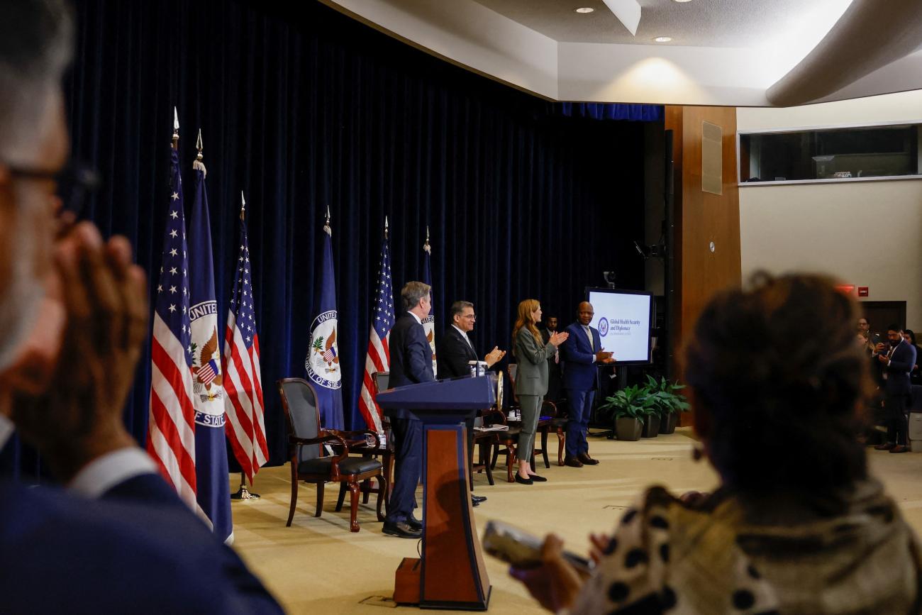 Attendees applaud at the launch of the Bureau of Global Health Security and Diplomacy at the State Department.