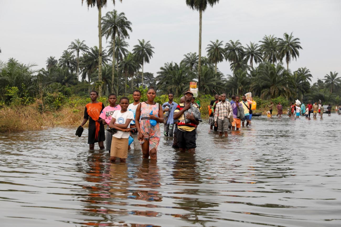 Residents wade through flood water in Obagi community Residents wade through flood water in Obagi community,