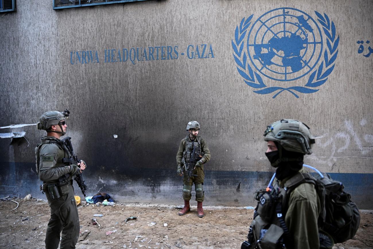 Israeli soldiers operate next to the UNRWA headquarters, amid the ongoing conflict between Israel and Hamas.