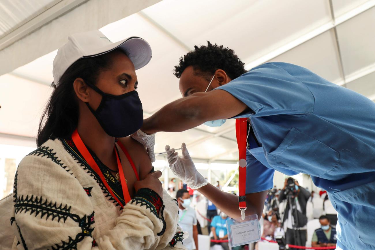 A health worker gets a dose of the Pfizer-BioNTech coronavirus disease (COVID-19) vaccine at a COVID-19 vaccination center in Seoul, South Korea, March 10, 2021.