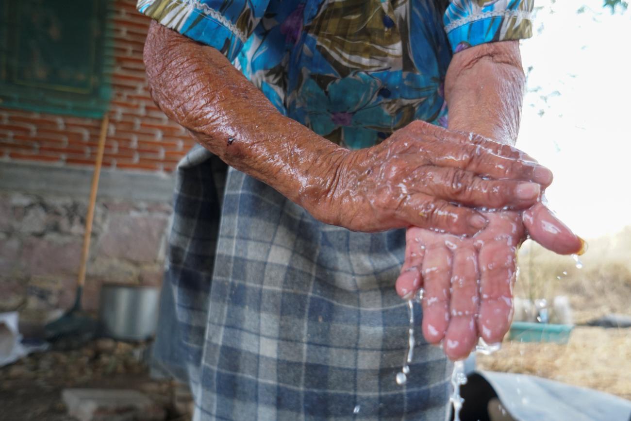 Zapotec woman washes her hands during the COVID-19 pandemic in Oaxaca state, Mexico, on March 31, 2020.