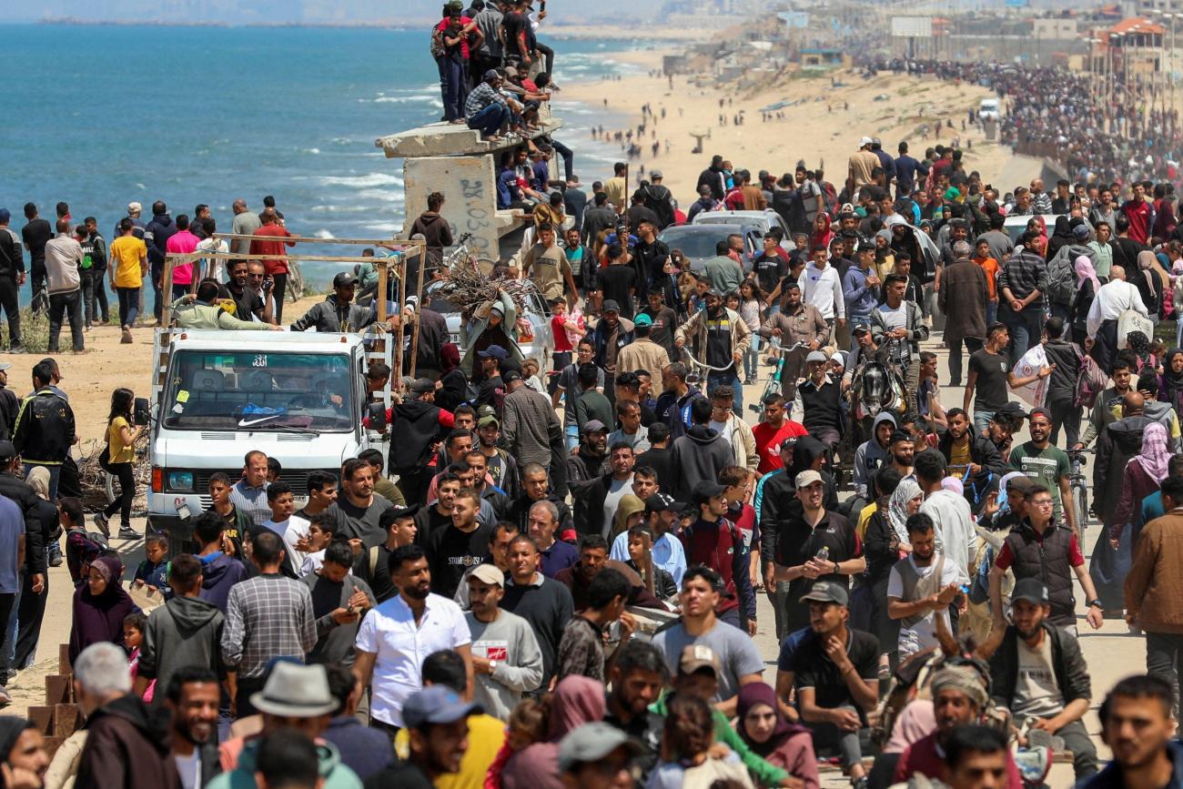 Palestinians, who were displaced by Israel's military offensive on south Gaza, make their way as they attempt to return to their homes in north Gaza.