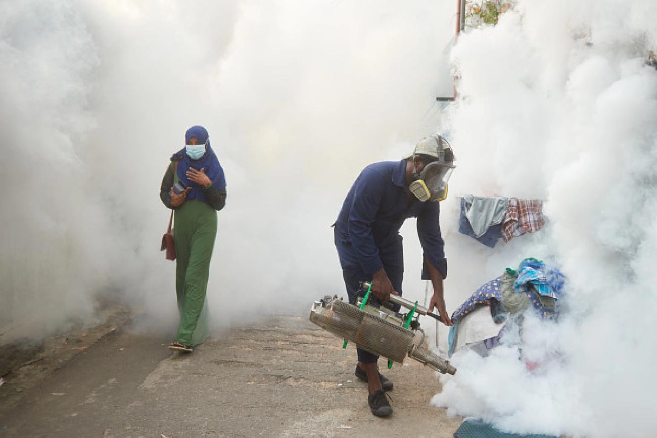 A man fogs the Siddhartha Road neighborhood.