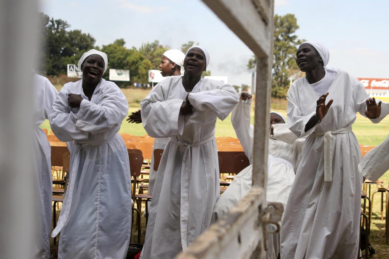 Women dance during a prayer against domestic and political violence.