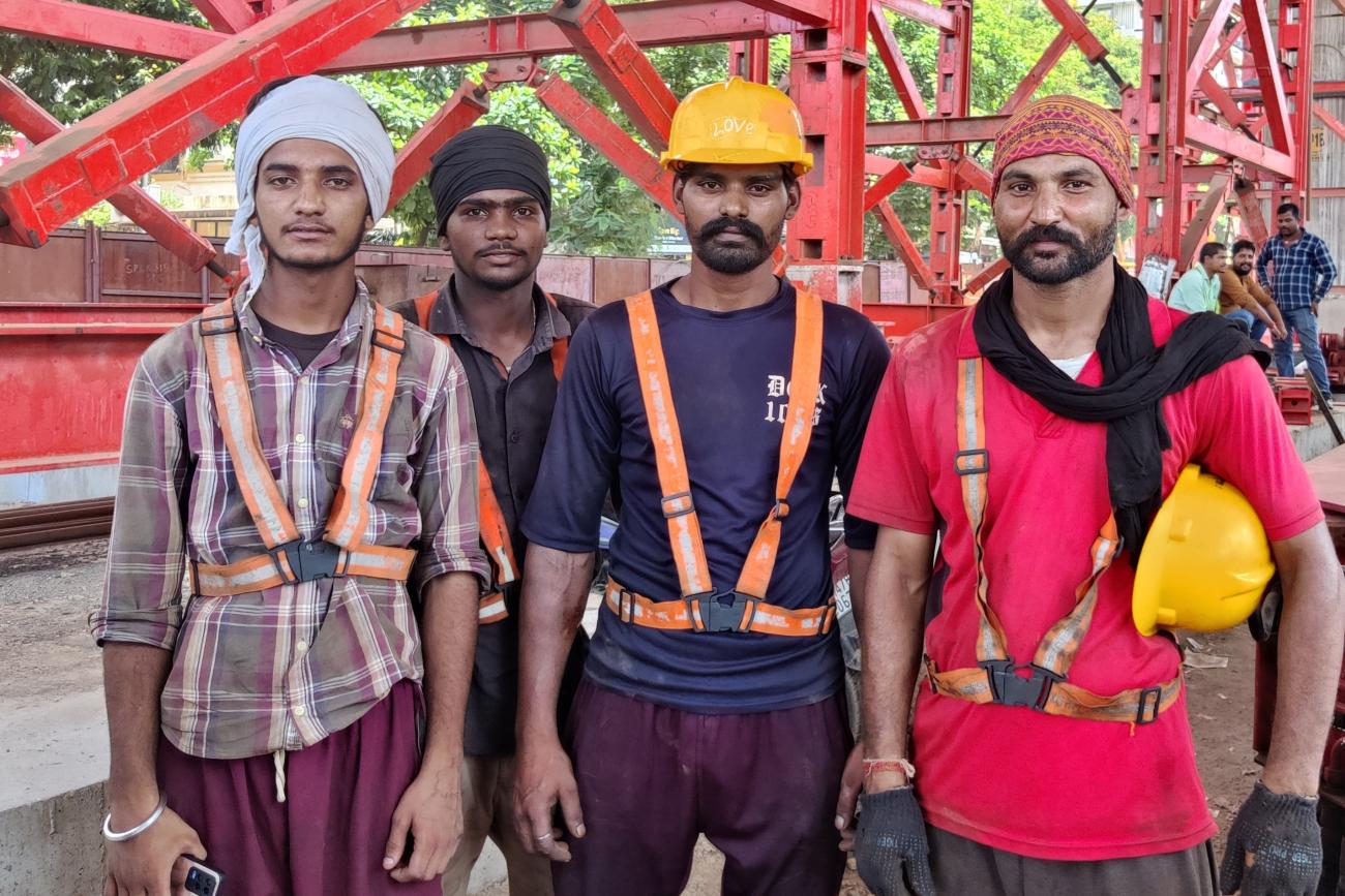 A group of construction workers stand for a photo.