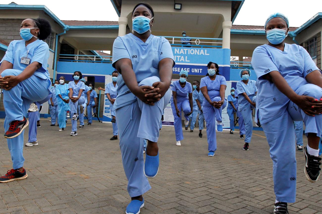 Nurses participate in a fitness program during the COVID-19 outbreak, within the Infectious Disease Unit grounds of the Kenyatta National Hospital.