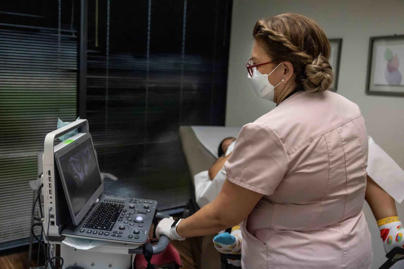 Catalina Leano, a licensed vocational nurse at Houston Women's Reproductive Services, performs an ultrasound with the clinic doctor present.