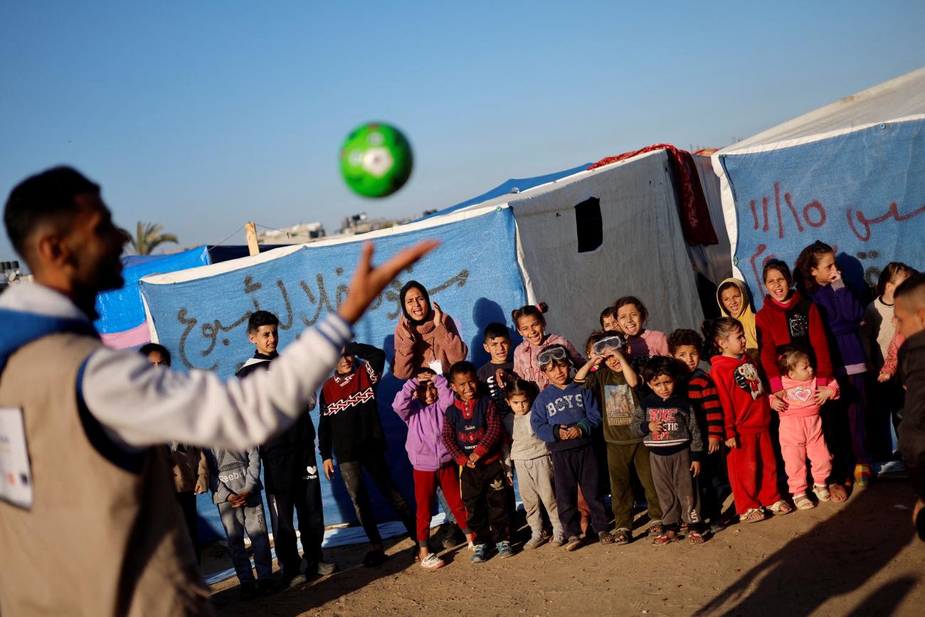 Displaced Palestinian children, who fled their houses due to Israeli strikes, take part in an entertaining activity organised by local activists, at a school run by United Nations Relief and Works Agency (UNRWA), to support the mental health of the children in Rafah, February 7, 2024. 