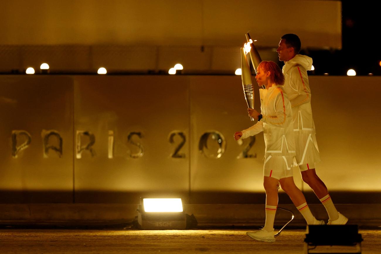 Alexis Hanquinquant of France and Nantenin Keita of France  prepare to light the cauldron during the opening ceremony of the Paris 2024 Paralympics.