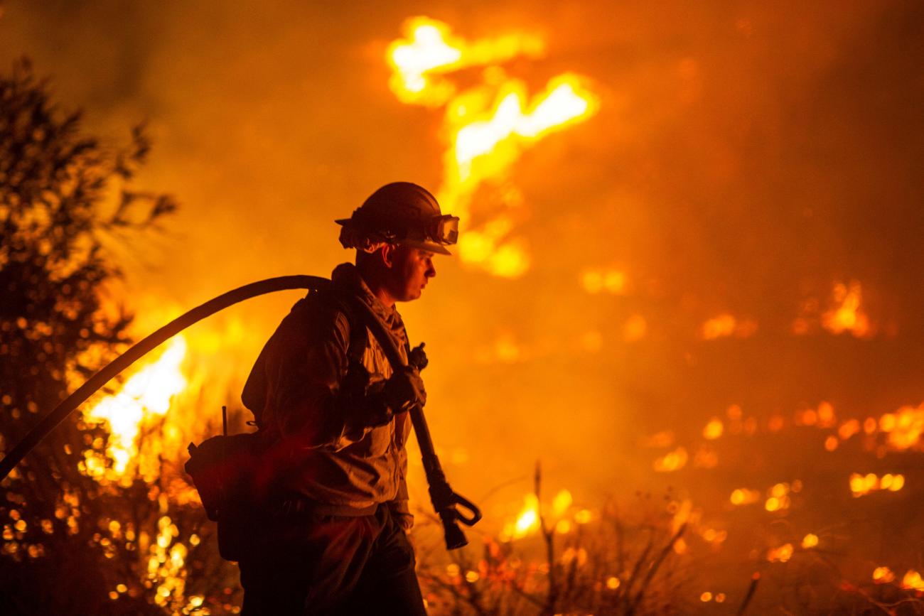 A firefighter battles the Hughes Fire near Castaic Lake, California, on January 22, 2025. 