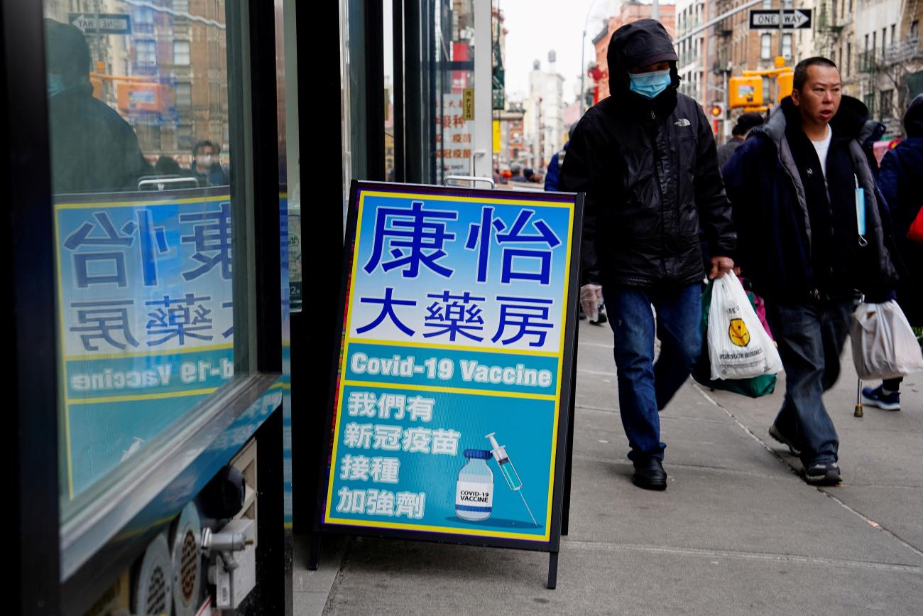 Chinese-language signage for COVID-19 vaccines sits outside of a pharmacy, New York City, New York, on February 12, 2023.