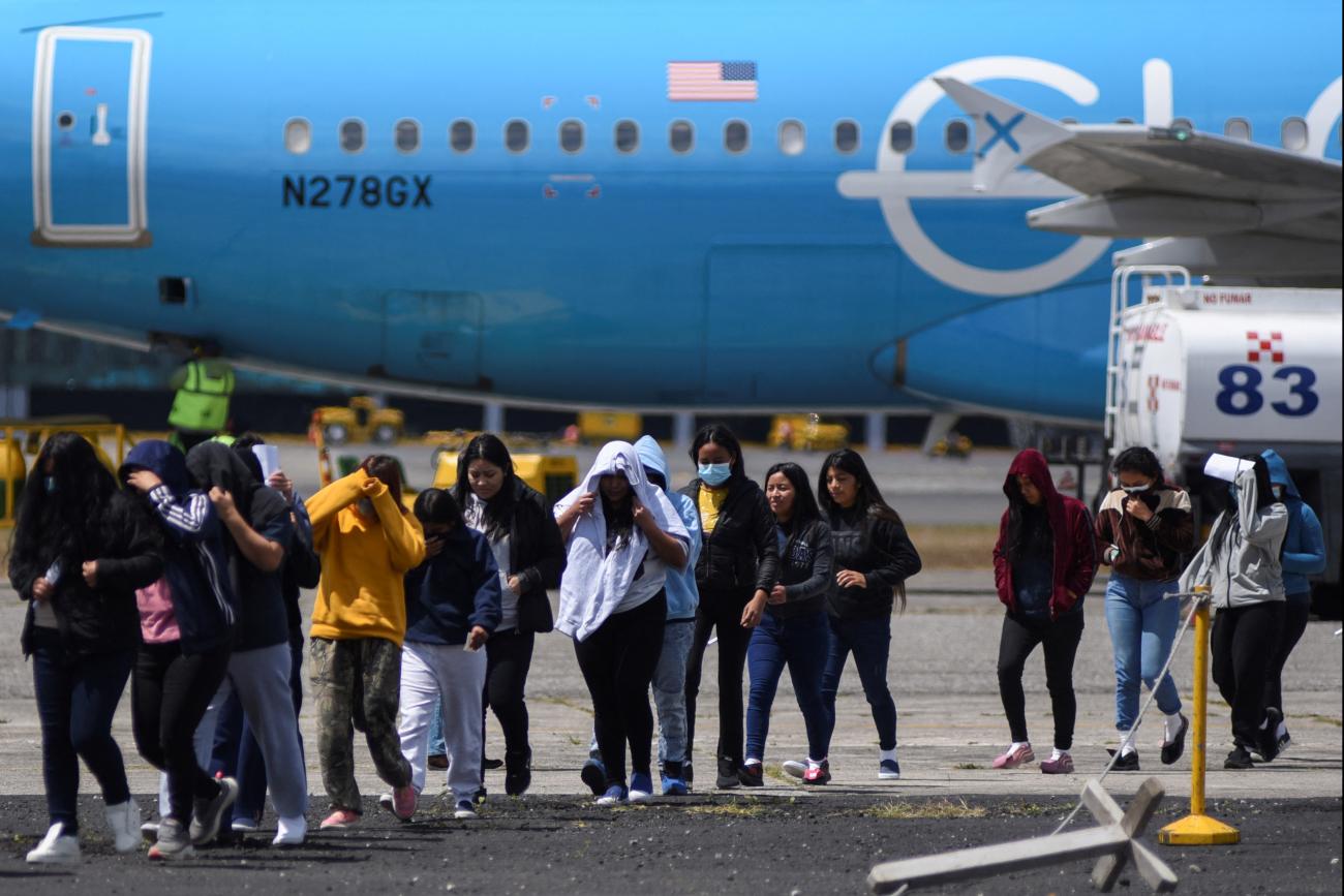 Guatemalan migrants arrive at La Aurora Air Base on a deportation flight from the United States, in Guatemala City, Guatemala, on February 18, 2025.