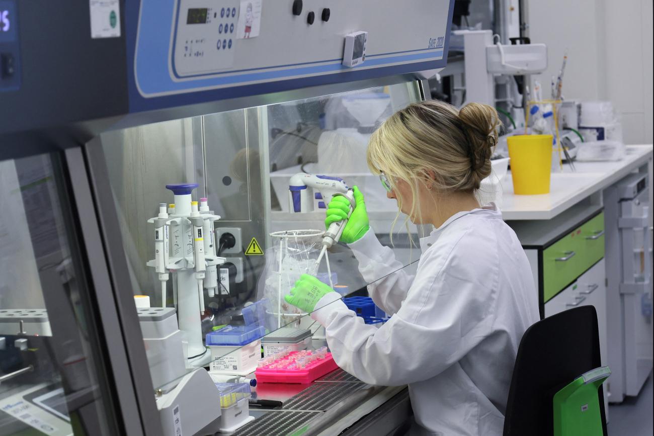 An employee of BioNTtech works at the "Area 100 R&D" research laboratory, in Mainz, Germany, on July 27, 2023. 