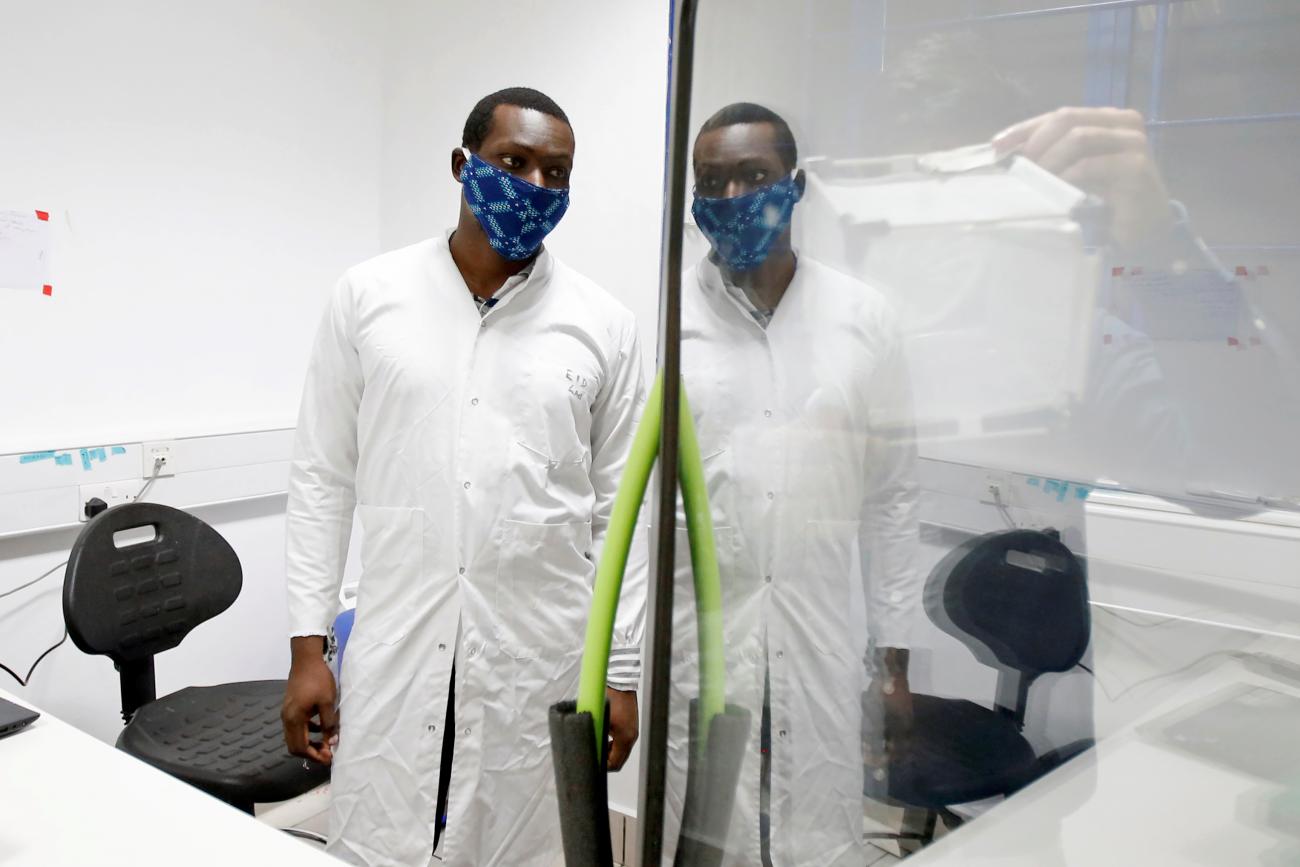 Researchers work on a microbe they say can protect mosquitoes from malaria, at the International Centre of Insect Physiology and Ecology headquarters, in Nairobi, Kenya on, May 11, 2020. 
