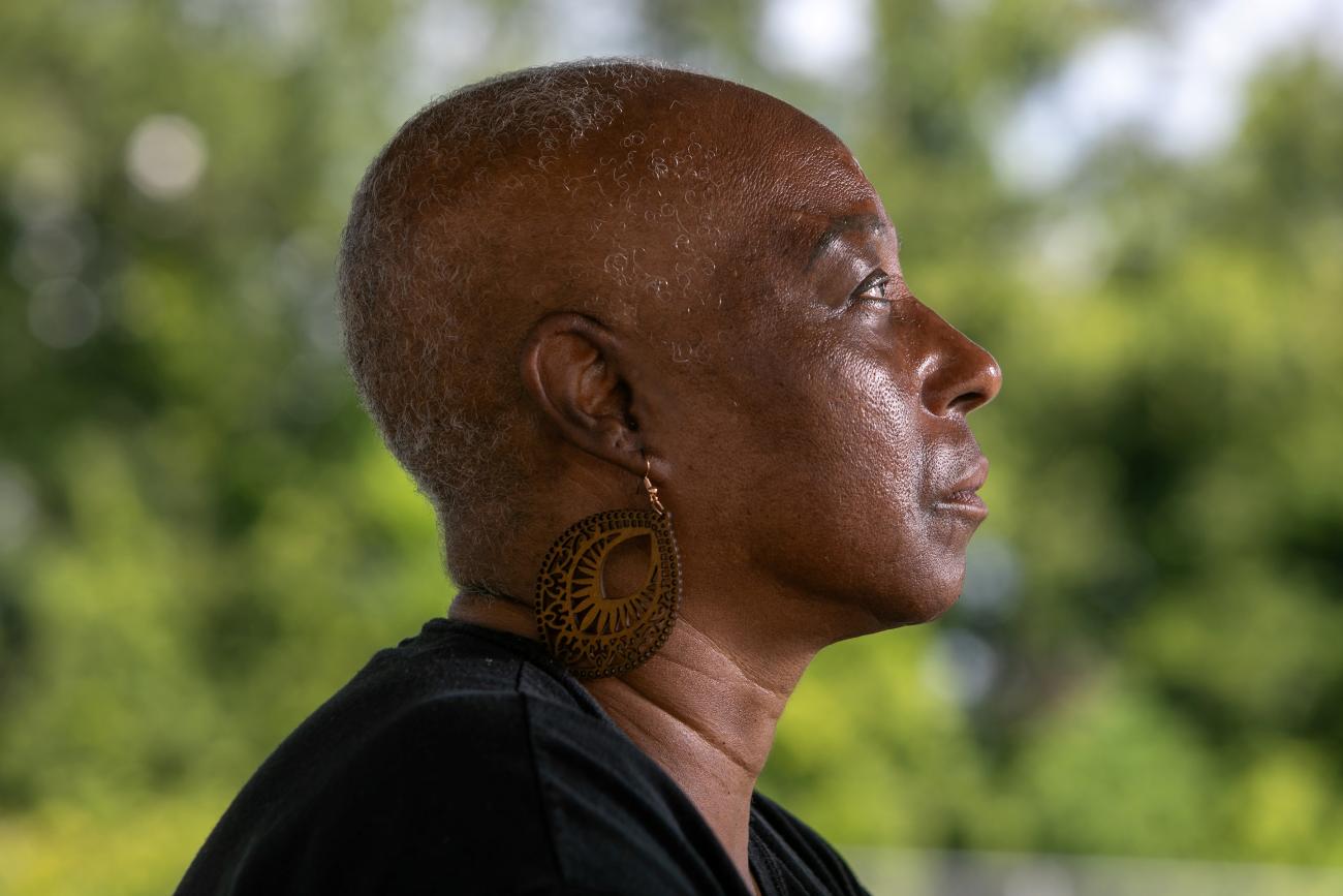 Veronica Jones, a survivor of aggressive breast cancer walks her neighborhood, in Convent, Louisiana, on Thursday June 26, 2025.