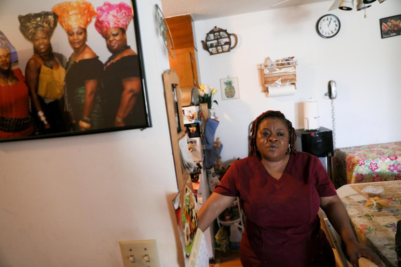 Deferred Enforced Departure status holder Marie Zar, who works as a nurse’s assistant, gets ready for work, in Brooklyn Center, Minnesota, on March 29, 2019.
