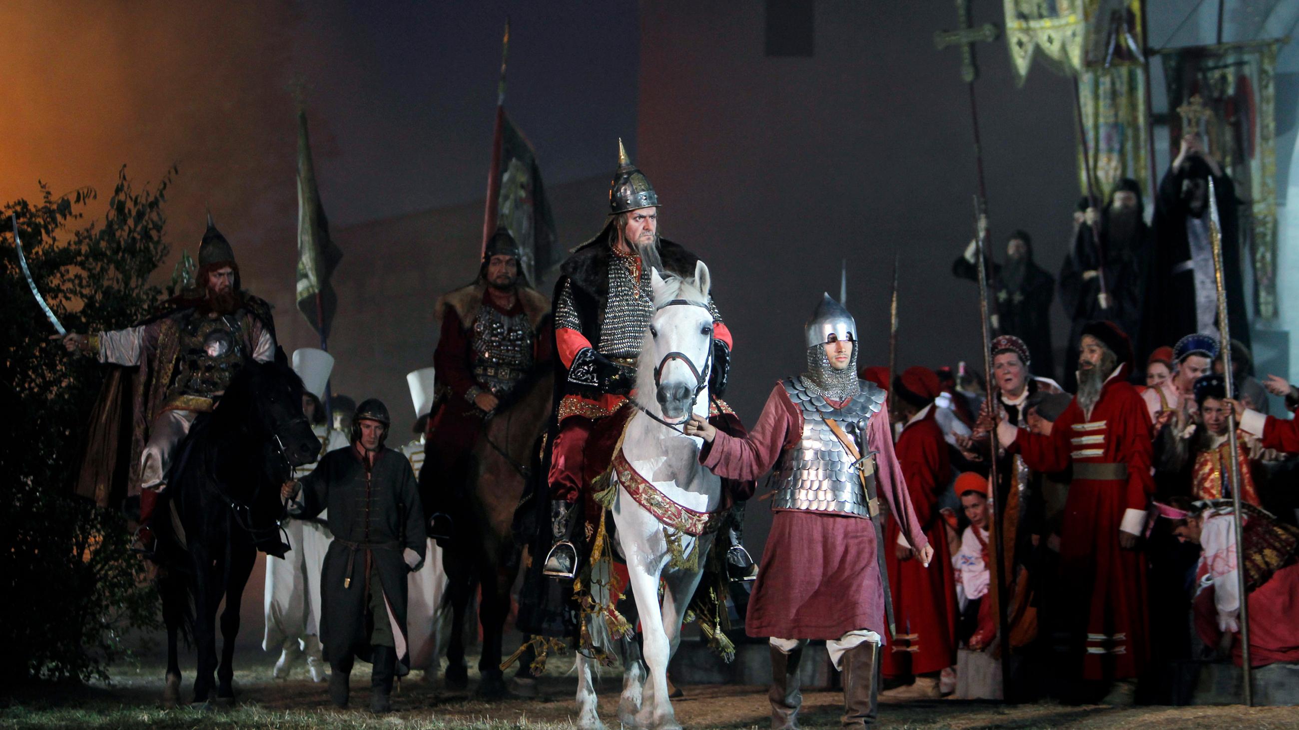 Photo shows the actor on horseback amidst lots of extras in a set with lavish costumes. REUTERS/Denis Sinyakov
