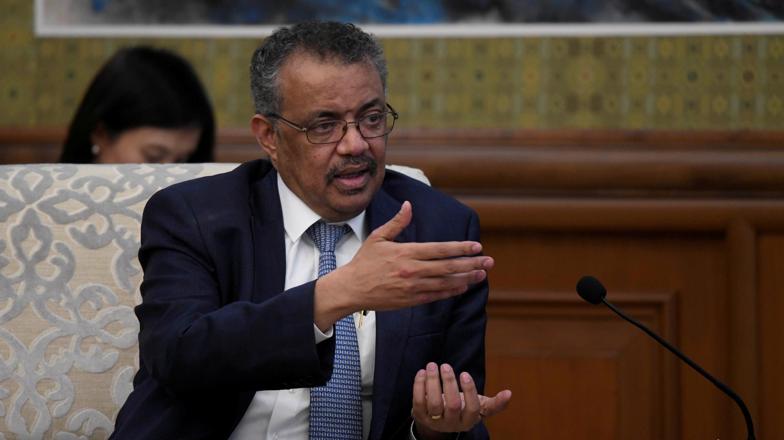 The photo shows Director-General Tedros talking and guesturing with his hands. 