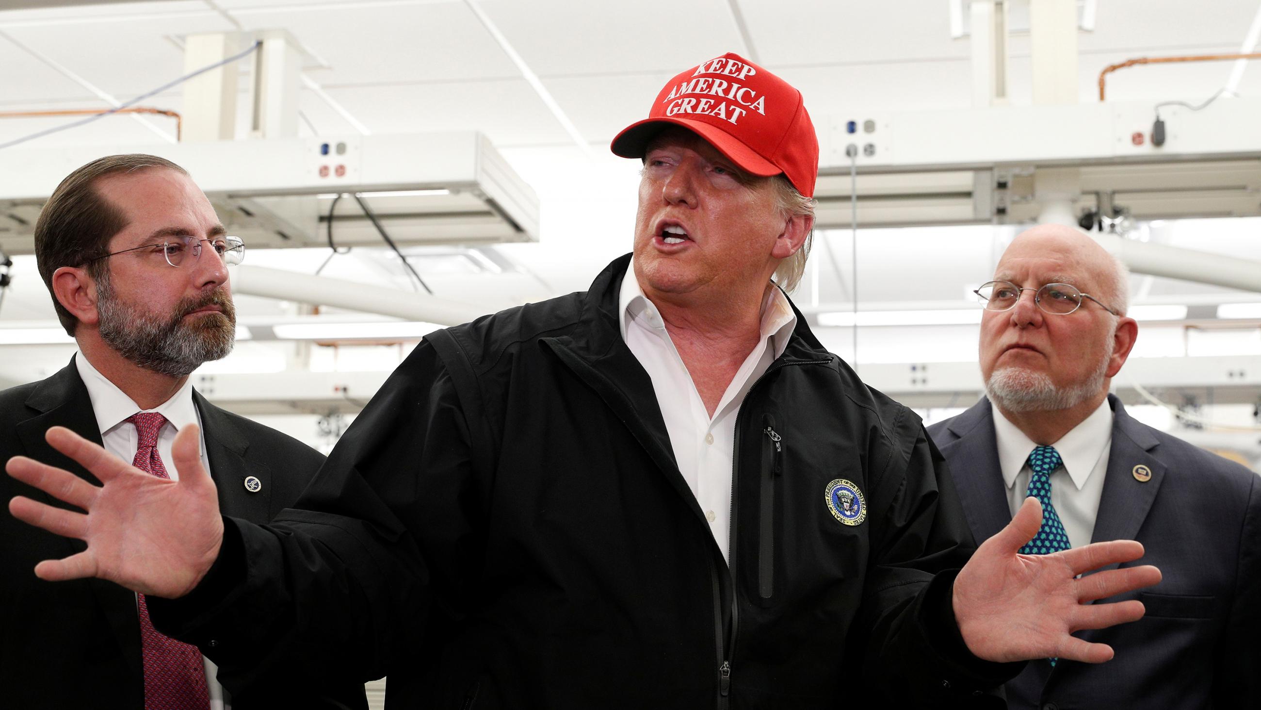 The photo shows the president with a "Make America Great Again" hat speaking and gesturing with his hands. 