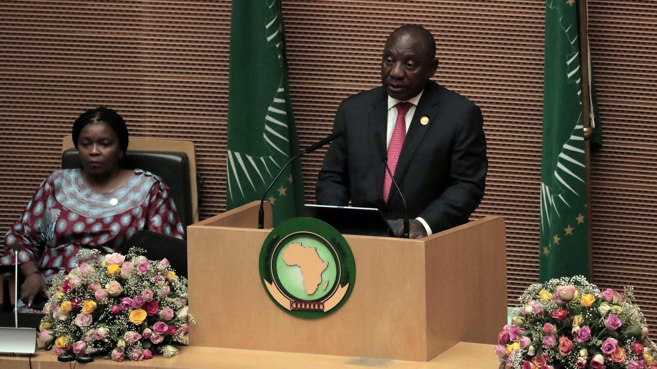 The photo shows the South African president at a podium speaking into a microphone. 