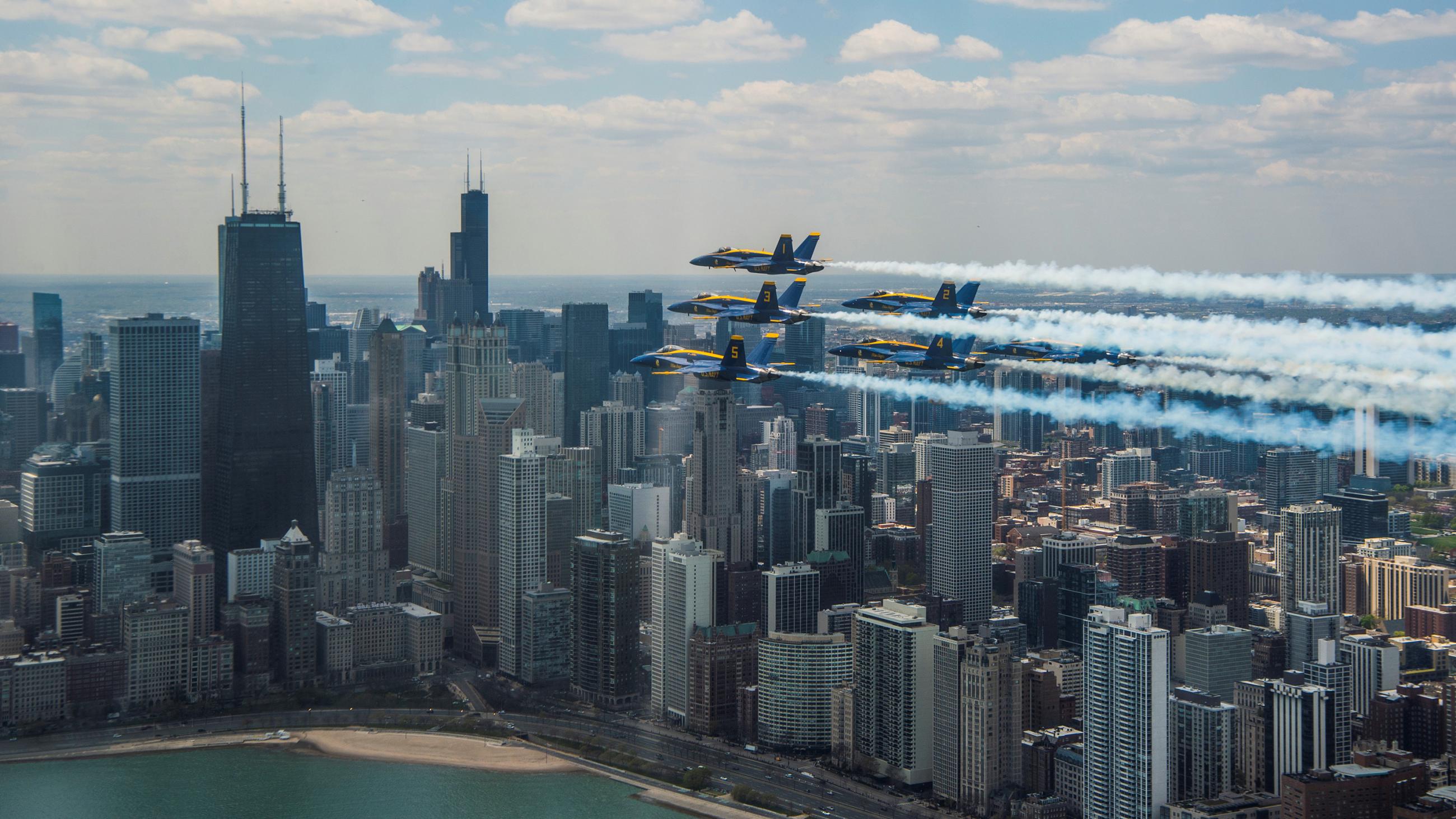 Picture shows the military jets flying over Chicago on a clear day. 