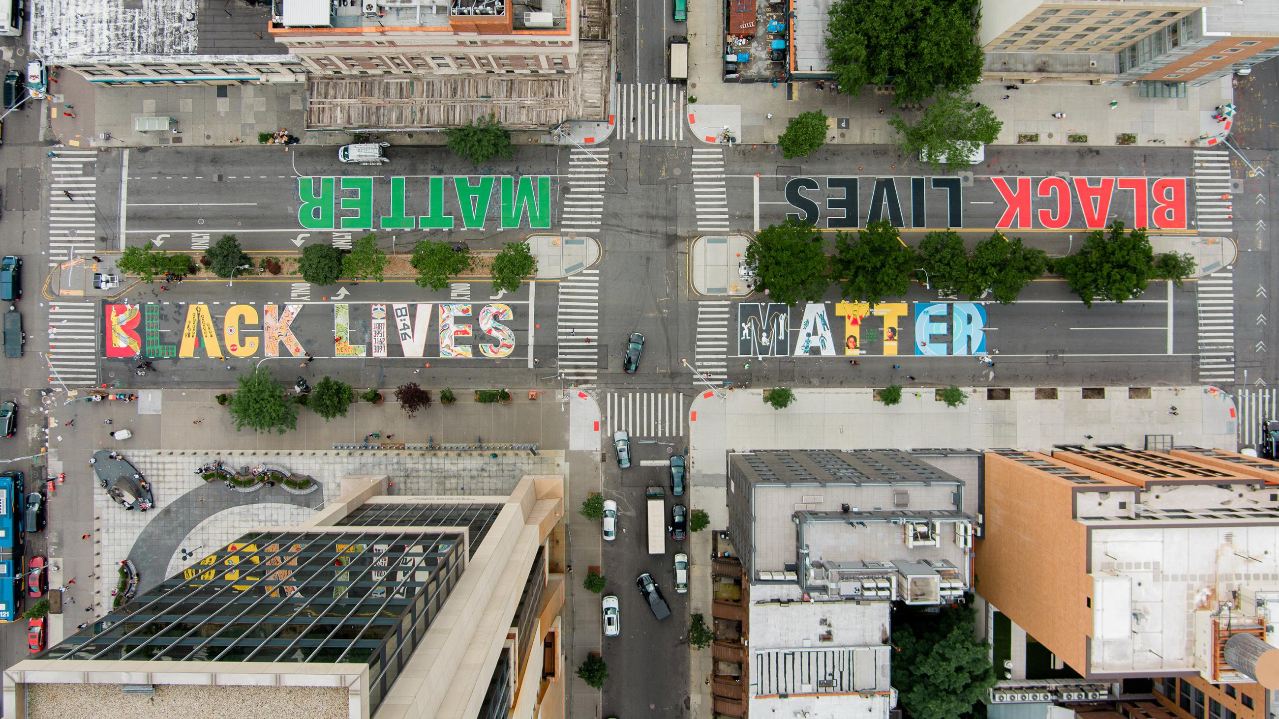 Picture from a drone flown above the street showing the colorful mural painted on the pavement. 