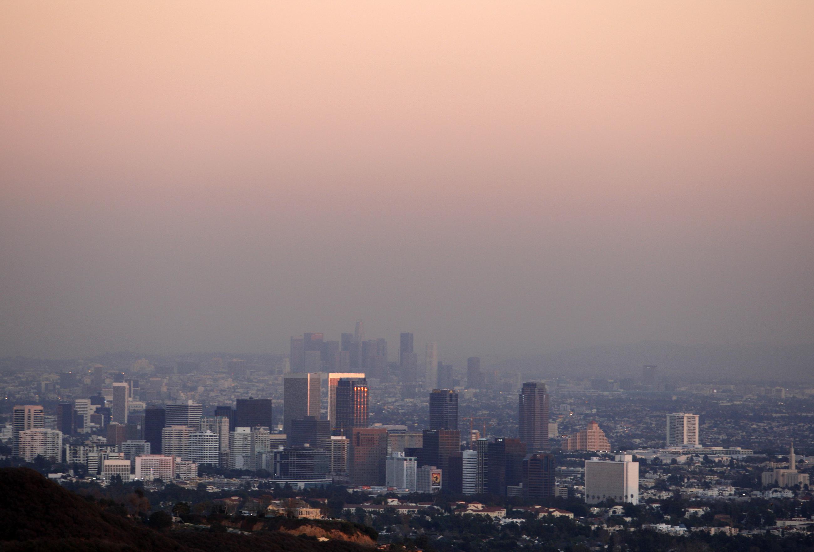 Century City and downtown Los Angeles are seen through the smog on December 31, 2007. REUTERS/Lucy Nicholson