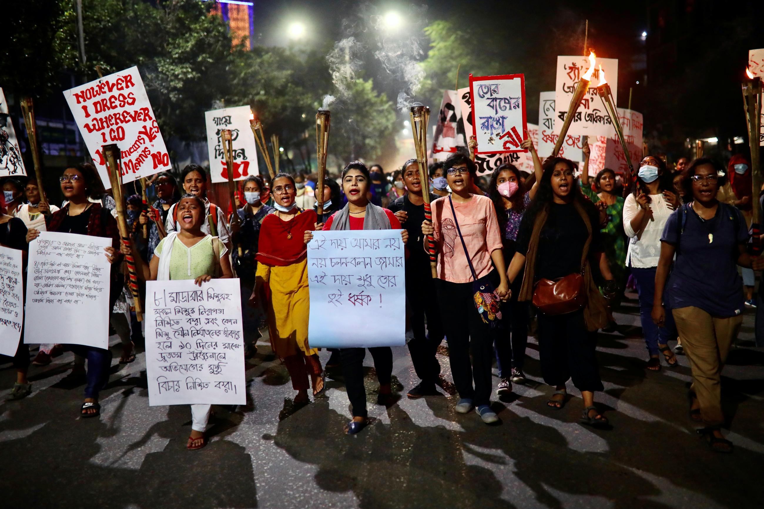 Female activists and students take part in a torch procession demanding women's safety and justice for rape victims amid the coronavirus disease (COVID-19) outbreak in Dhaka, Bangladesh on October 14, 2020. REUTERS/Mohammad Ponir Hossain