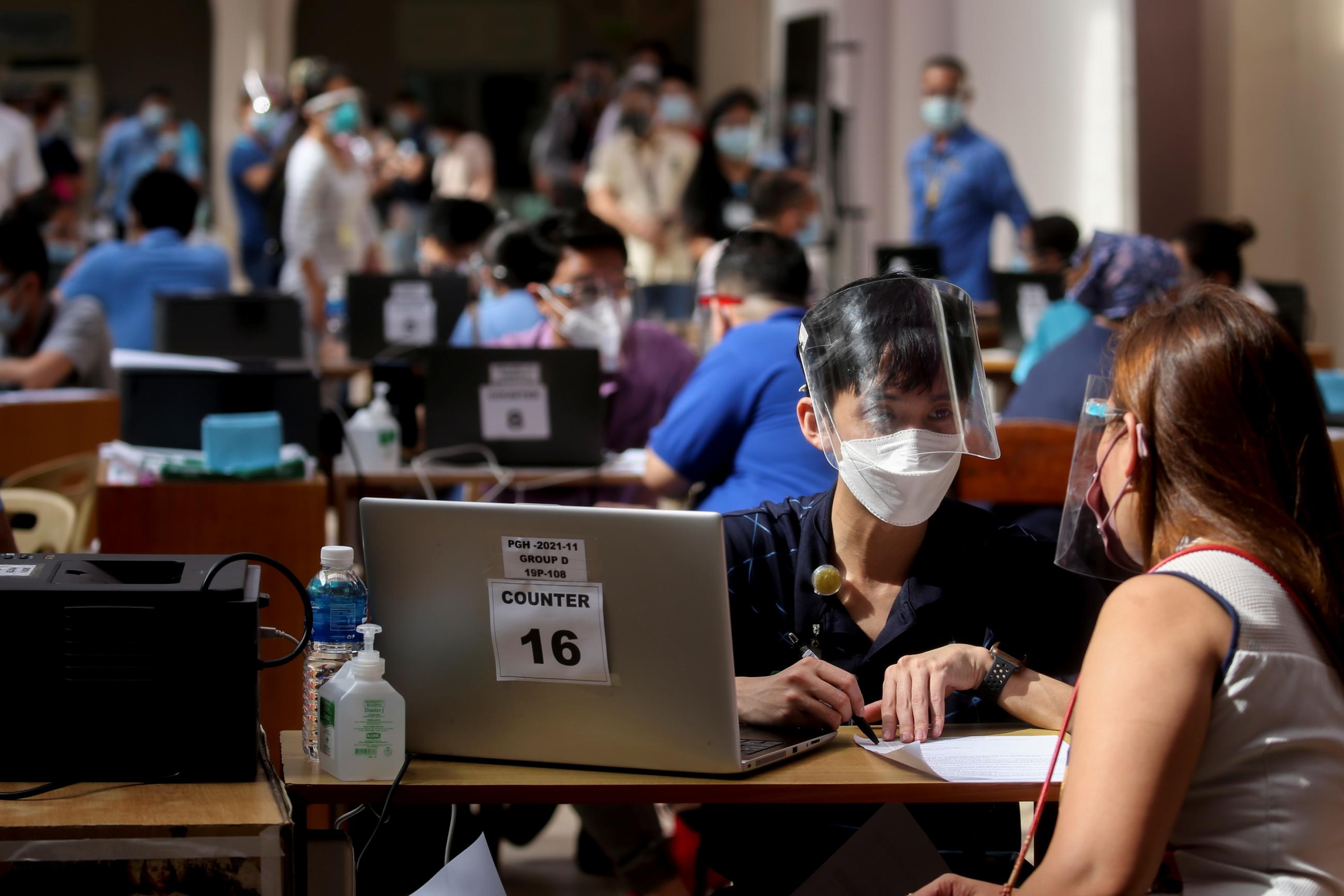 Health workers and employees of Philippine General Hospital register for COVID-19 vaccination, expected to arrive this month, at the Philippine General Hospital in Manila, Philippines, February 9, 2021.