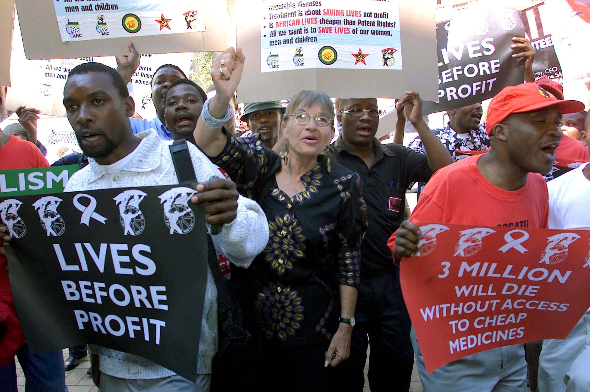 Demonstrators celebrate victory after international pharmaceutical companies have dropped their court bid to prevent South Africa from generic versions of their patented AIDS drugs in Pretoria, South Africa on April 19, 2001.