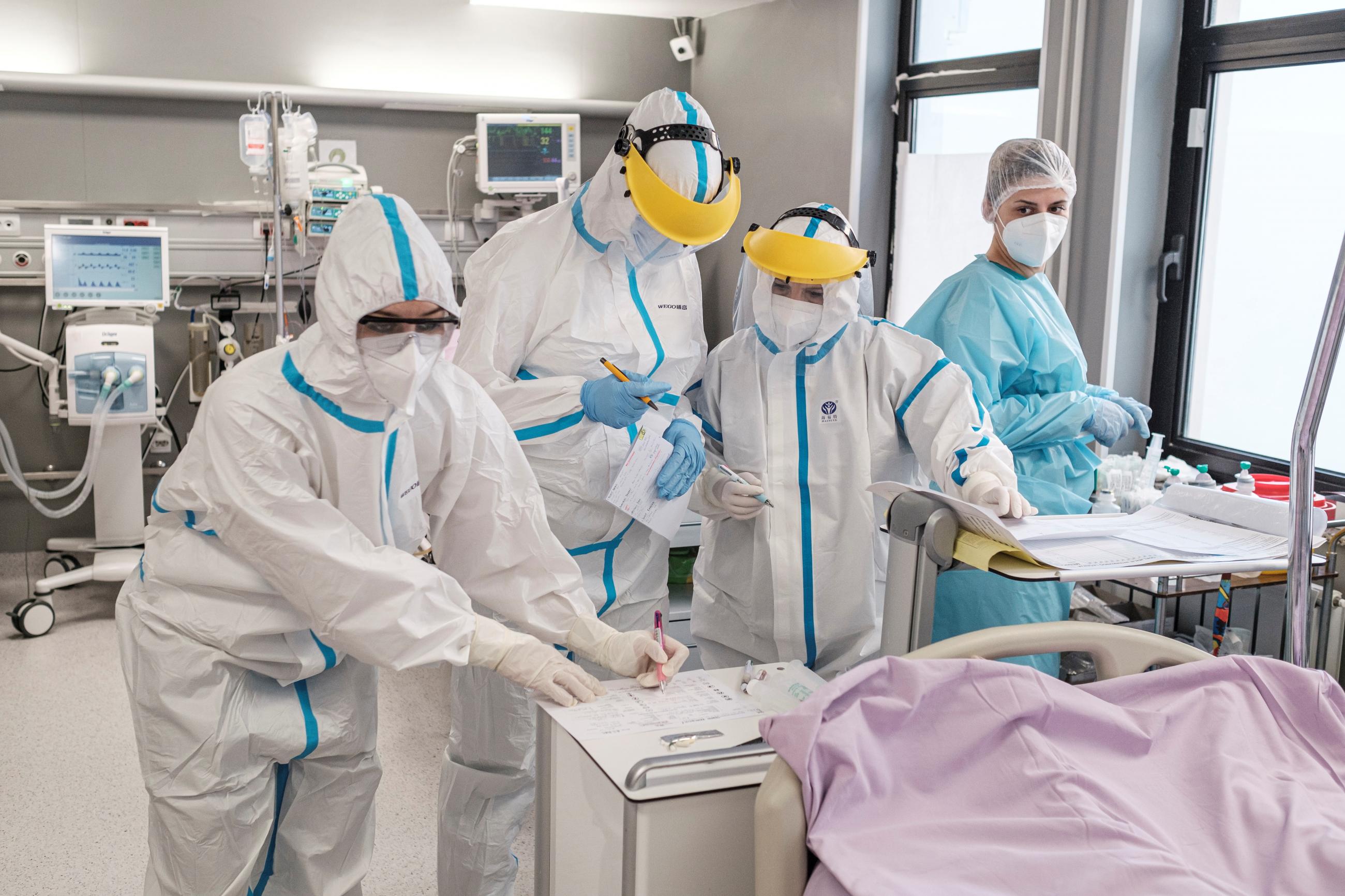 Doctors and nurses treat patients suffering from the coronavirus disease at the intensive care unit of the Clinical Center of Vojvodina in Novi Sad, Serbia, March 8, 2021.