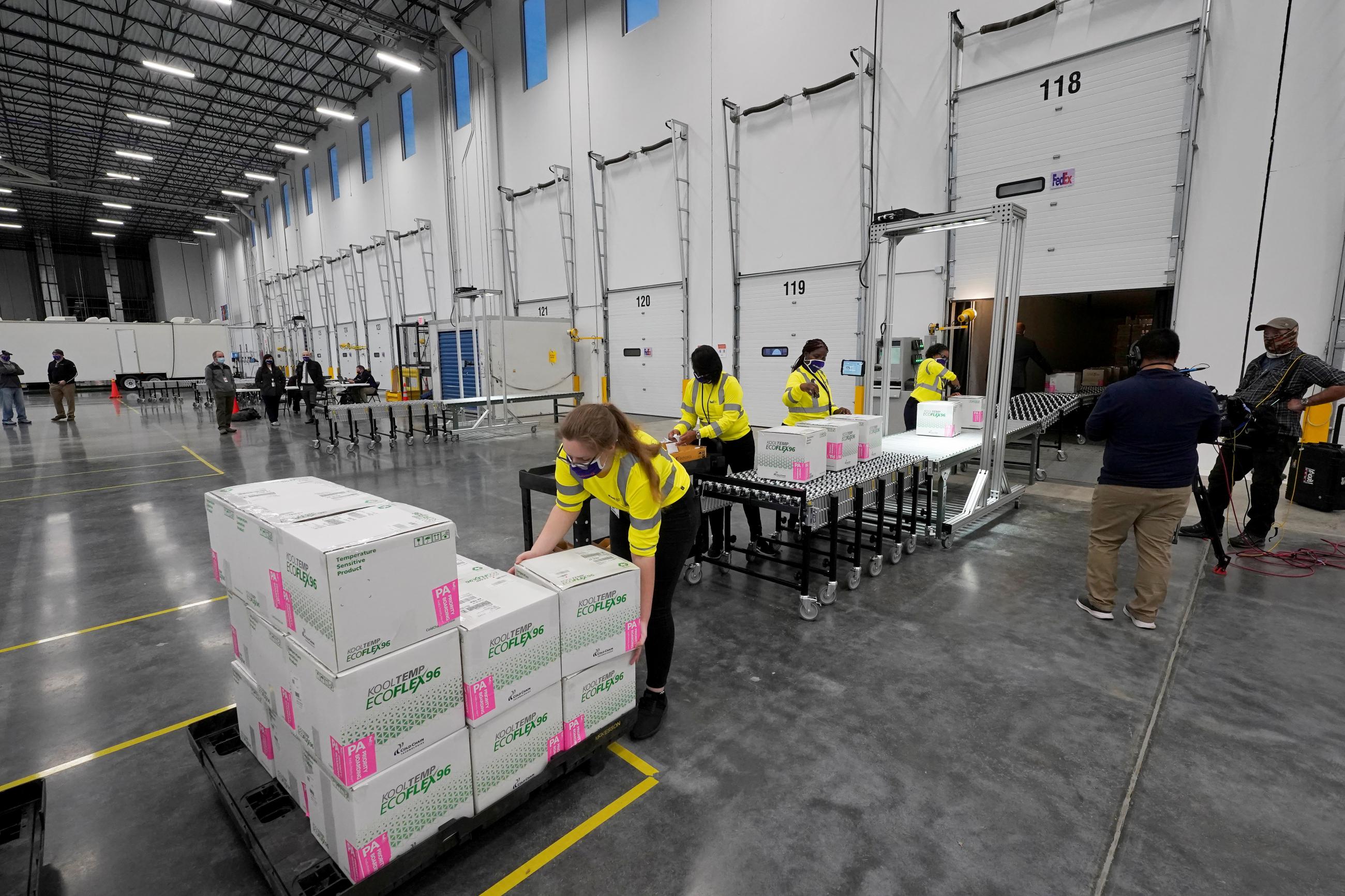 Boxes containing the Moderna COVID-19 vaccine are prepared for shipment at the McKesson distribution center in Olive Branch, Mississippi on December 20, 2020.