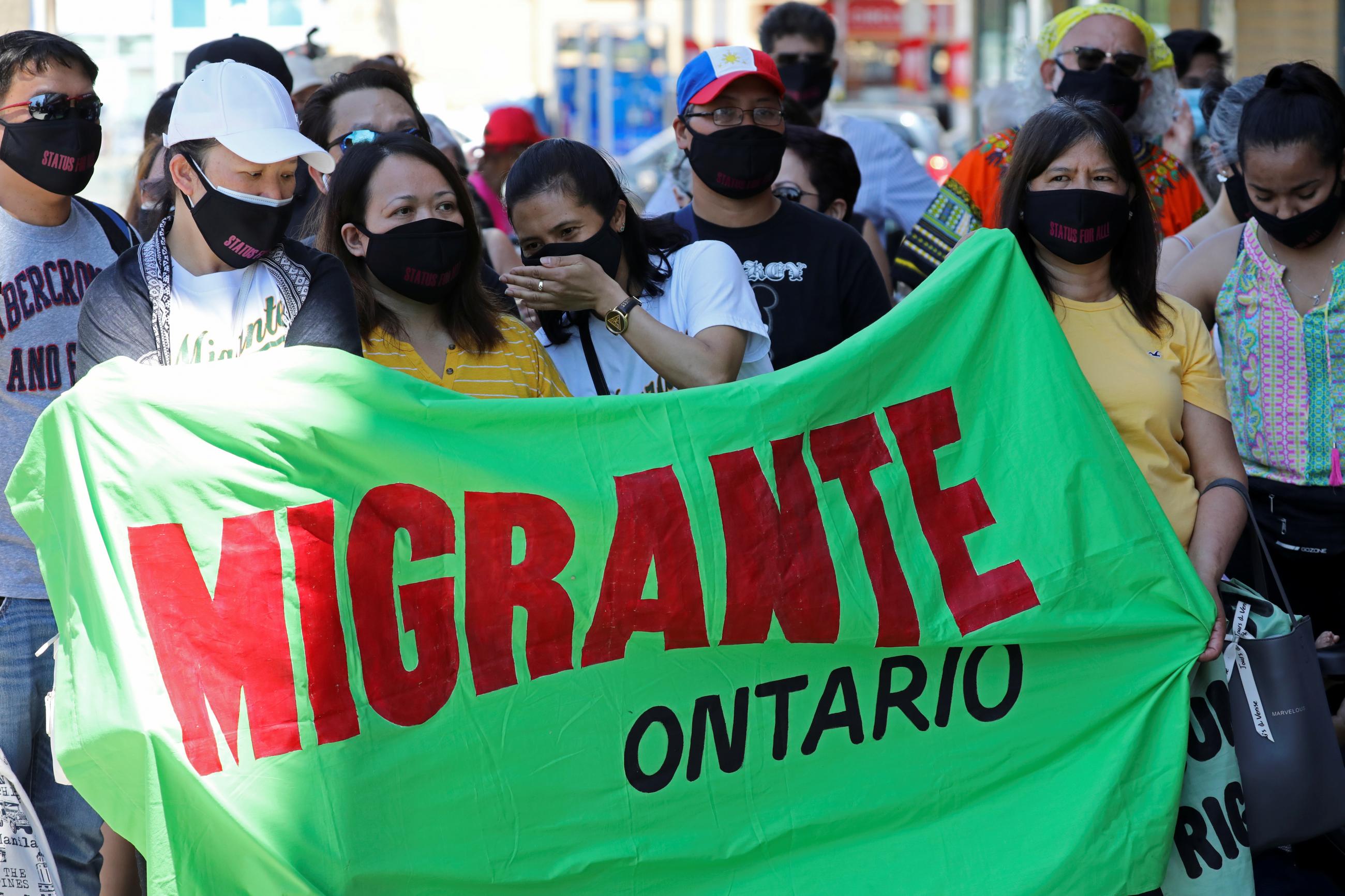 Migrants, refugees, undocumented workers and their supporters rally outside the office Canada's Immigration Minister Marco Mendicino in Toronto, Ontario, Canada on July 4, 2020.