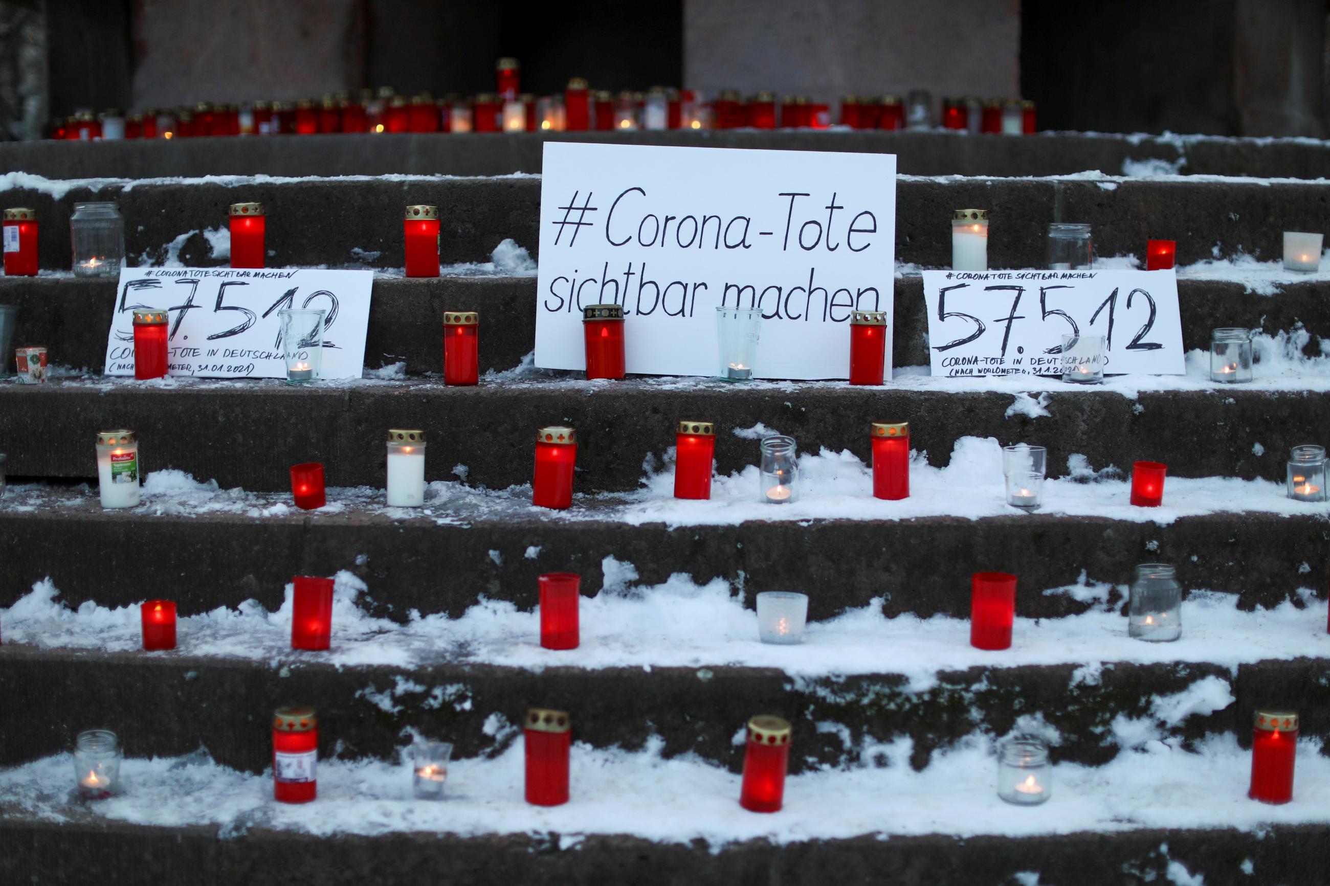 A sign reading "make the corona deaths visible" is pictured during a vigil organised by activist-group #wirgebendenToteneinGesicht (We give a face to the dead) to commemorate the people who died due to the coronavirus disease (COVID-19), in Berlin, Germany, January 31, 2021