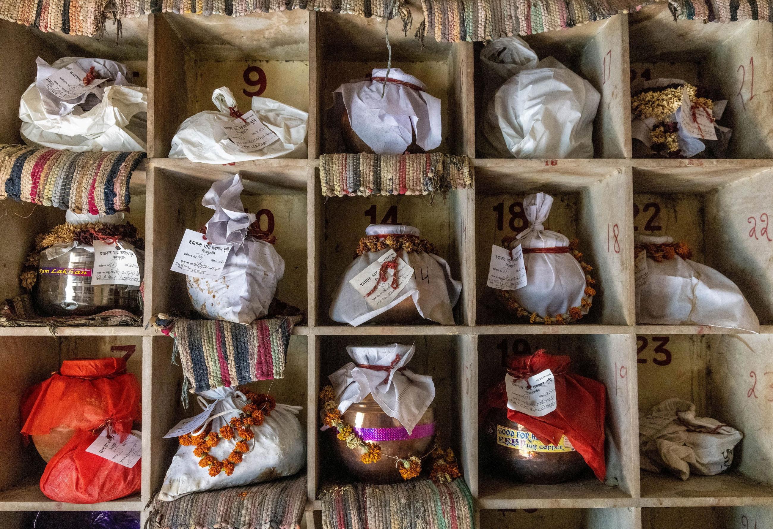 Urns containing ashes after final rites of people including those who died from the coronavirus disease (COVID-19) await immersion due to lockdown, at a crematorium in New Delhi, India, May 6, 2021.